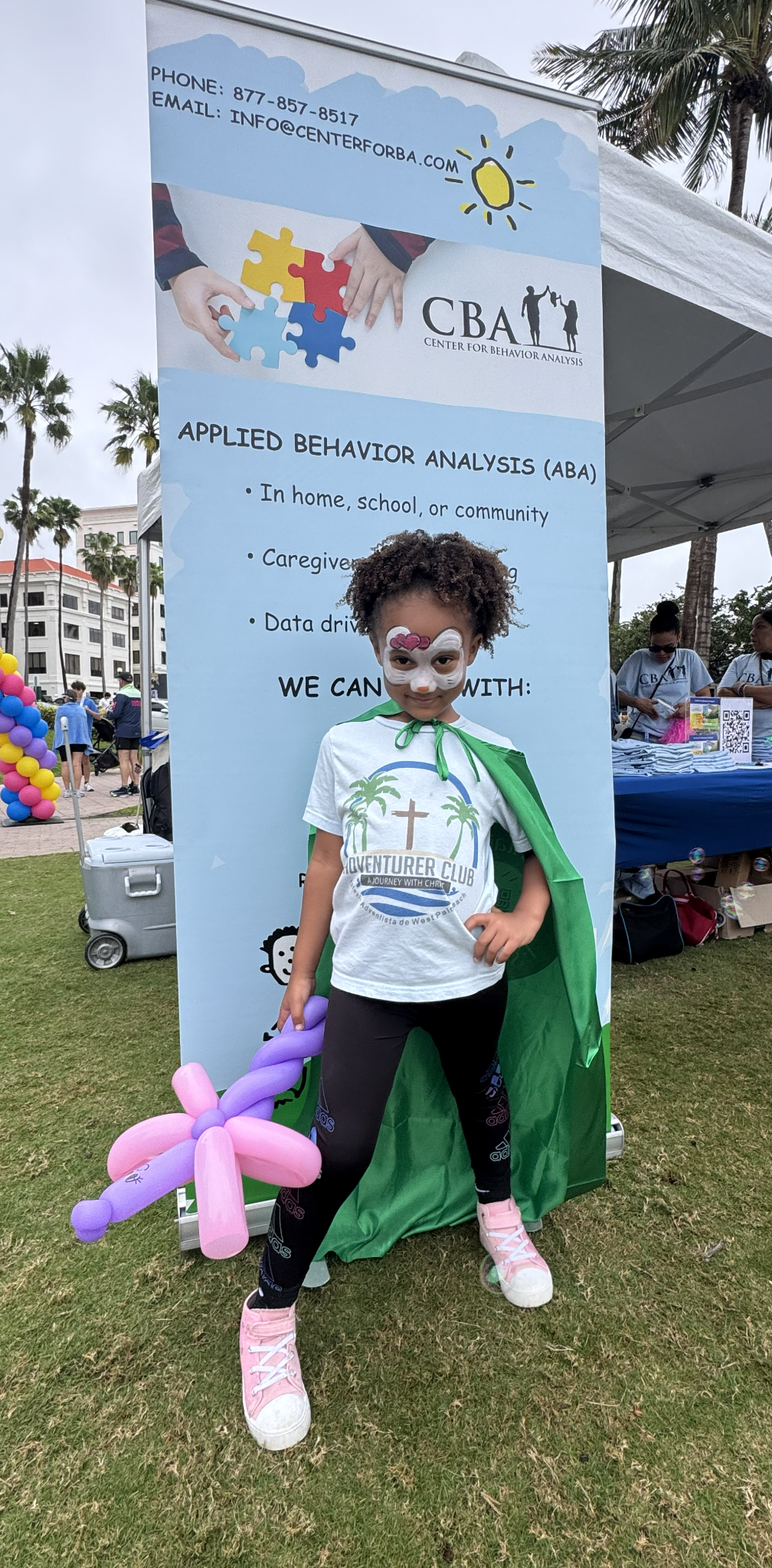 Child at CBA community booth
